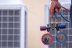 2485 Technician is checking air conditioner ,measuring equipment for filling air conditioners.